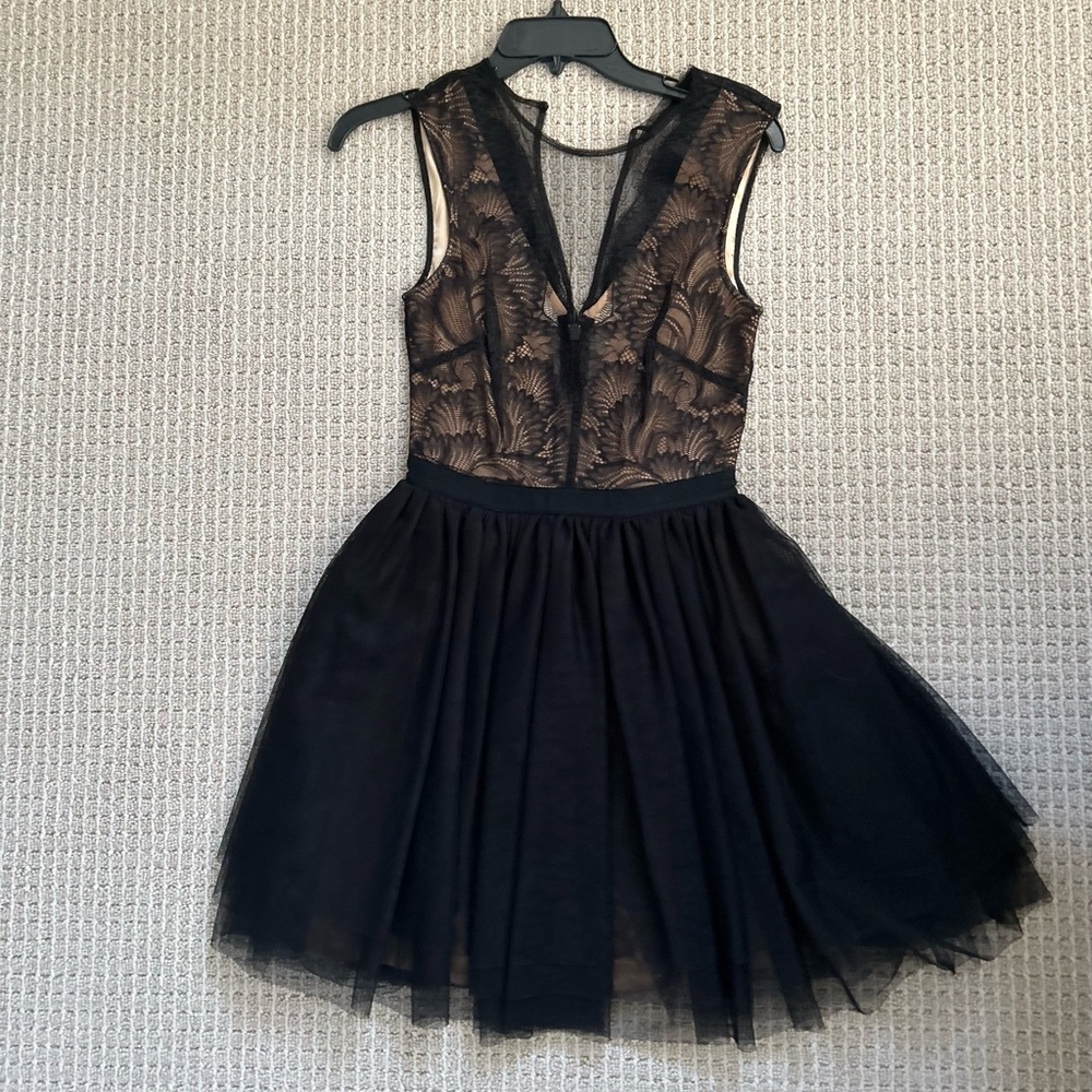 Bebe, size XS, worn once. Like new condition. Nude with black lace